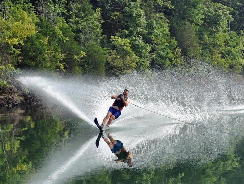Glide across the glass like waters while surrounded by lush forest Glide across the glass like waters while surrounded by lush forest Photos