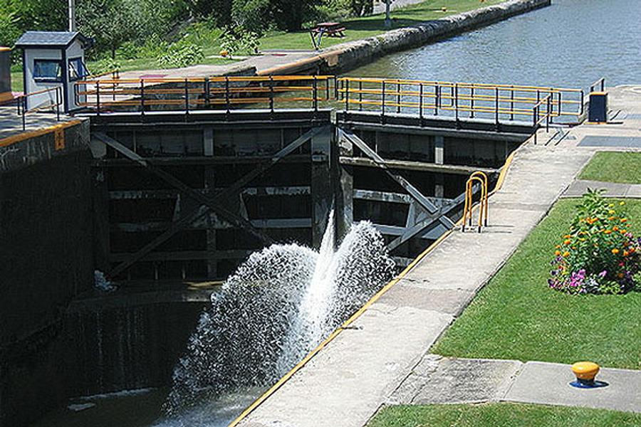 As water pours through a lock the level falls to that of the next section
