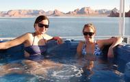 Relax with friends while soaking in the hot tub on the top deck