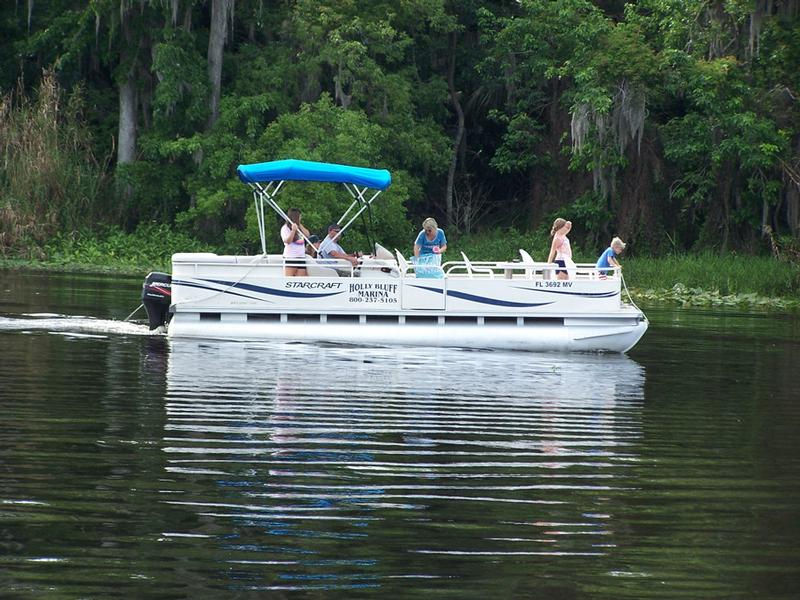 Enjoy a sunny day out on the water aboard a cozy Pontoon Picnic Boat