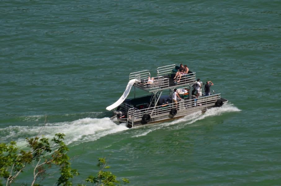 Spend a day in the sun exploring the lake with friends on a patio boat