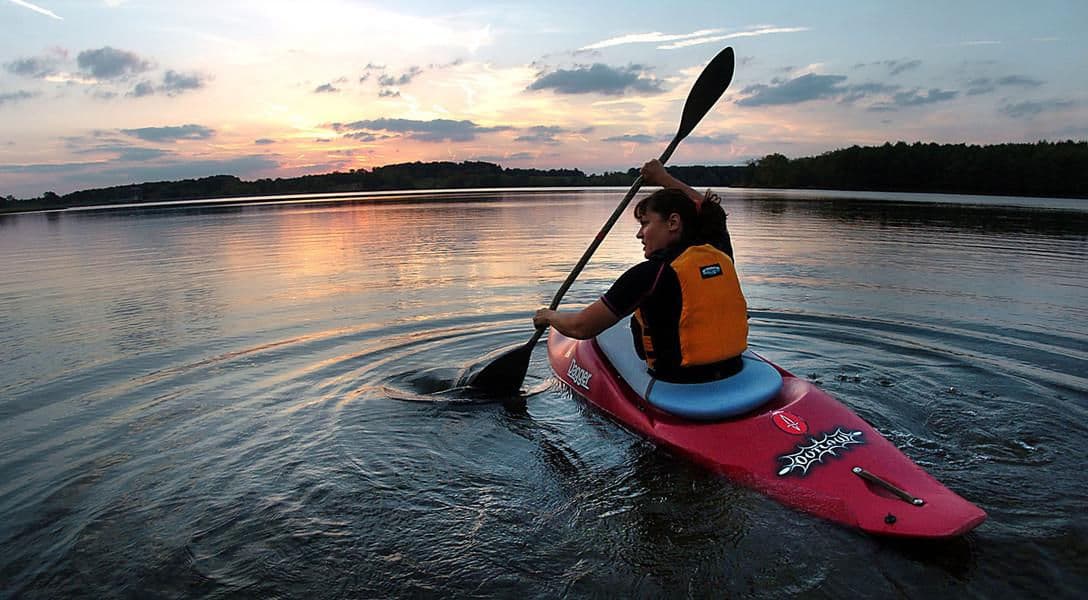 Paddling out to the light of the early sun