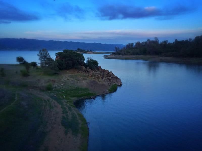 The calm that comes at dusk reflects on glassy waters