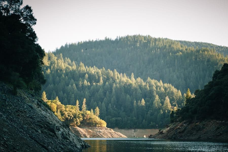 Layered hills and sun covered trees provide a breathtaking view