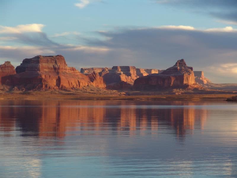 Red canyons fill the blue open sky providing a most astonishing view