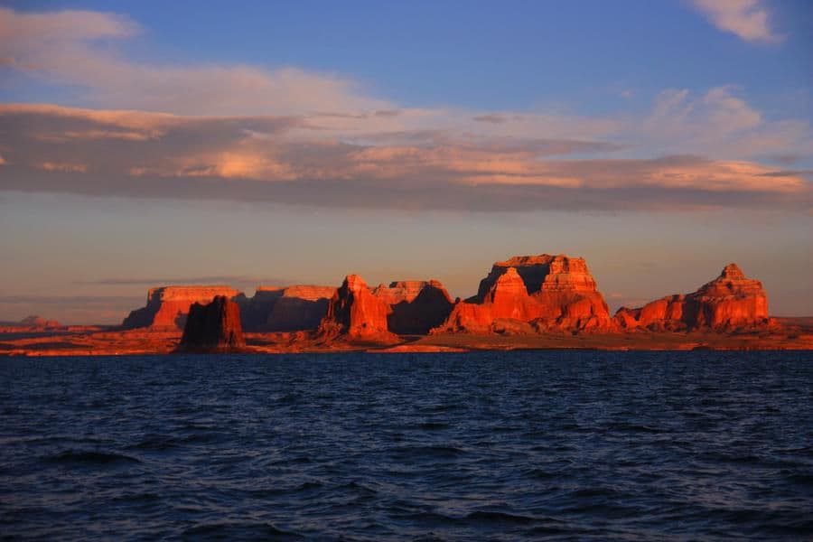 Tall canyons surrounded by vast blue waters just into open skies