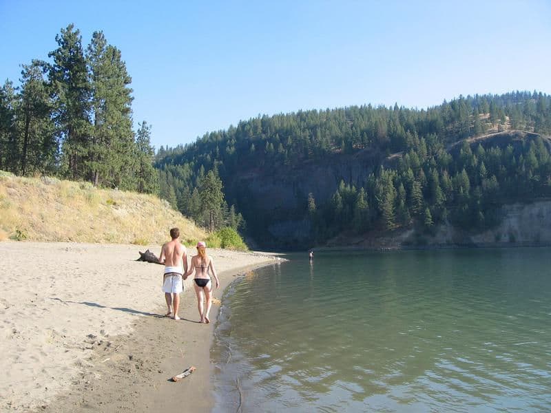 Walking along a lakeside beach