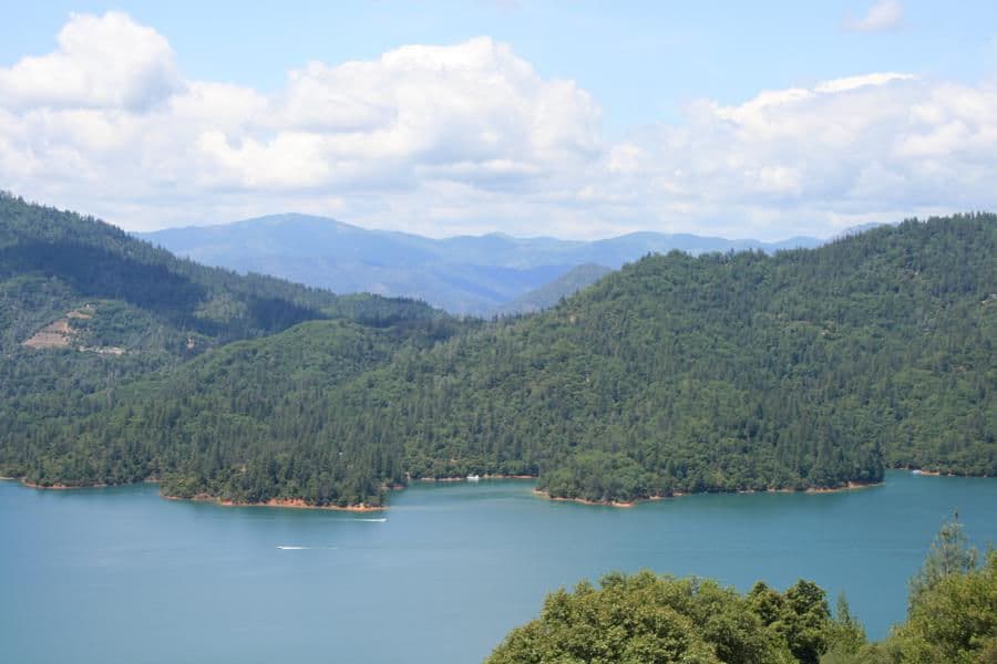 Enjoy the scenery of lush mountain ranges towering into blue skies