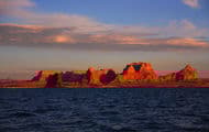 Tall canyons surrounded by vast blue waters just into open skies