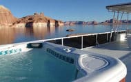 Travel in luxury as you relax on the large top deck in warm waters