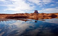 Glassy water merges with the stunning scenery