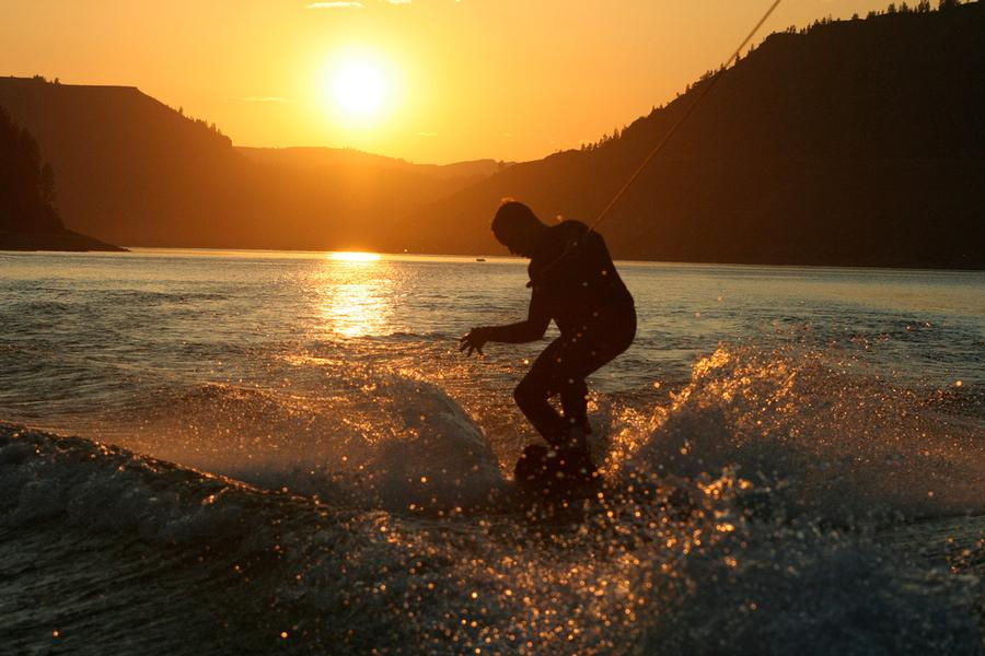 Wake boarding at sunset makes for striking memories