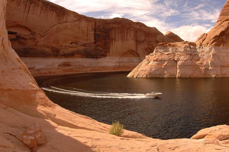Most of the land around the north end of Lake Powell is exposed rock - countless square miles of multicolored sandstone and limestone strata, heavily eroded into many different forms.Numerous branched canyons cut deep into the layered rocks and join the lake or the Colorado and Dirty Devil rivers upstream, and apart from White Canyon, south of Hite, none are particularly well known.