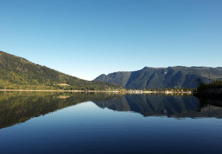 Glassy water as the dock fades away