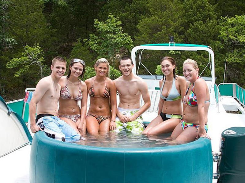 Take to the hot tub with friends on your houseboat's top deck Photos
