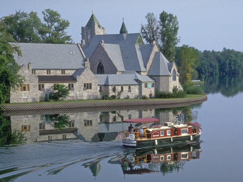 Classic, old-world style architecture nestled against the water Photos