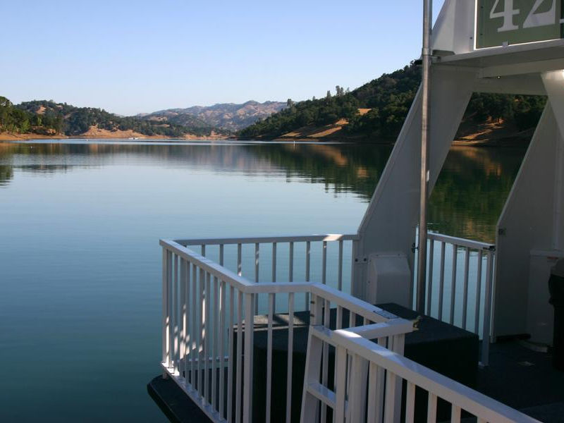 Take in a peaceful view of the lake from the deck of the houseboat Photos