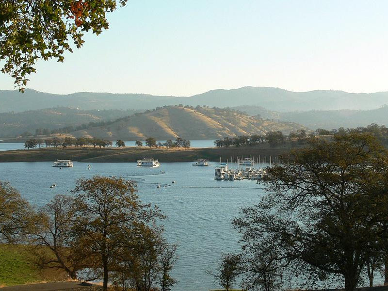 Blue waters surrounded by a scenic mountain range Photos