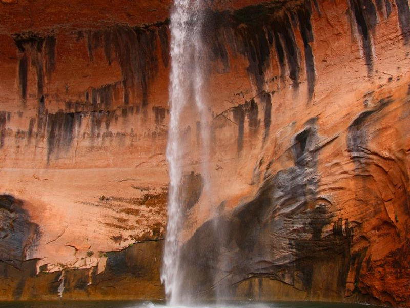 Leftover rain offers a sense of waterfalls cascading off canyons Photos