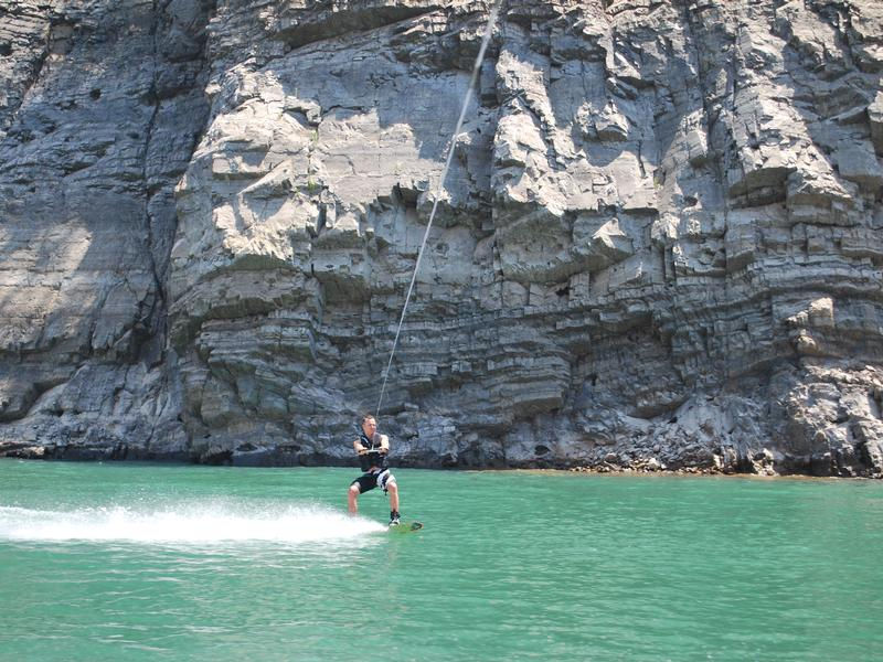 Towering cliffs offer a picturesque background while riding the waters Towering cliffs offer a picturesque background while riding the waters Photos
