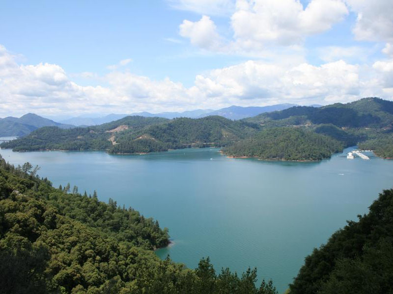 Take a hike up the hills to enjoy a breathtaking view of Shasta Lake Photos