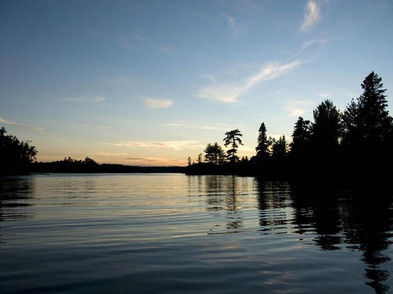 Peaceful sunset and still waters Photos