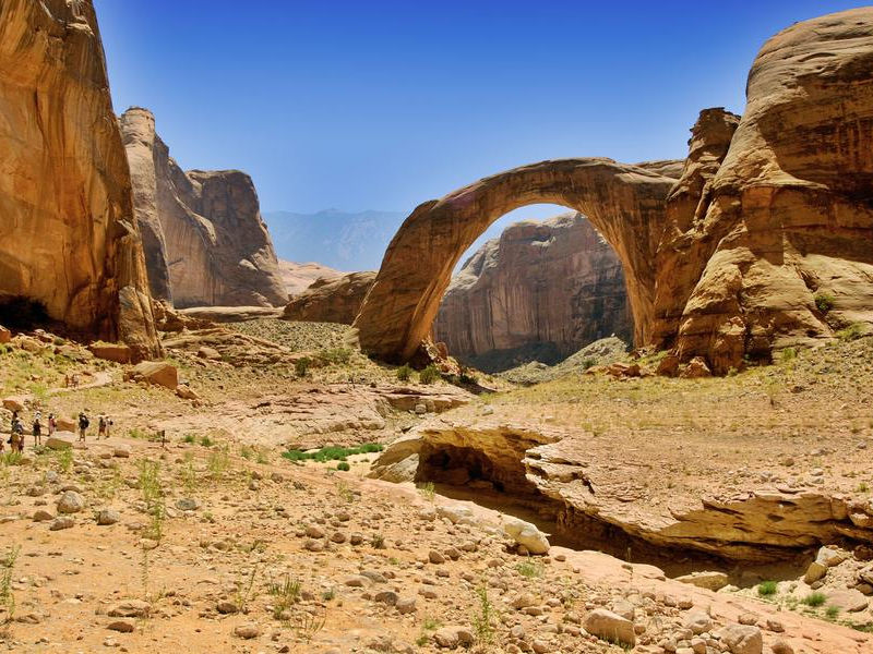 Take a hike to the famous Rainbow Bridge at Lake Powell Photos