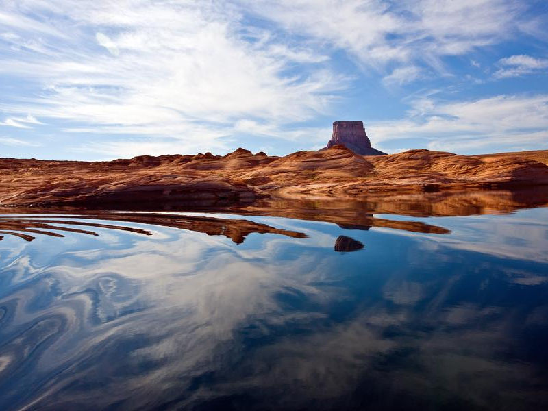 Glassy water merges with the stunning scenery Photos