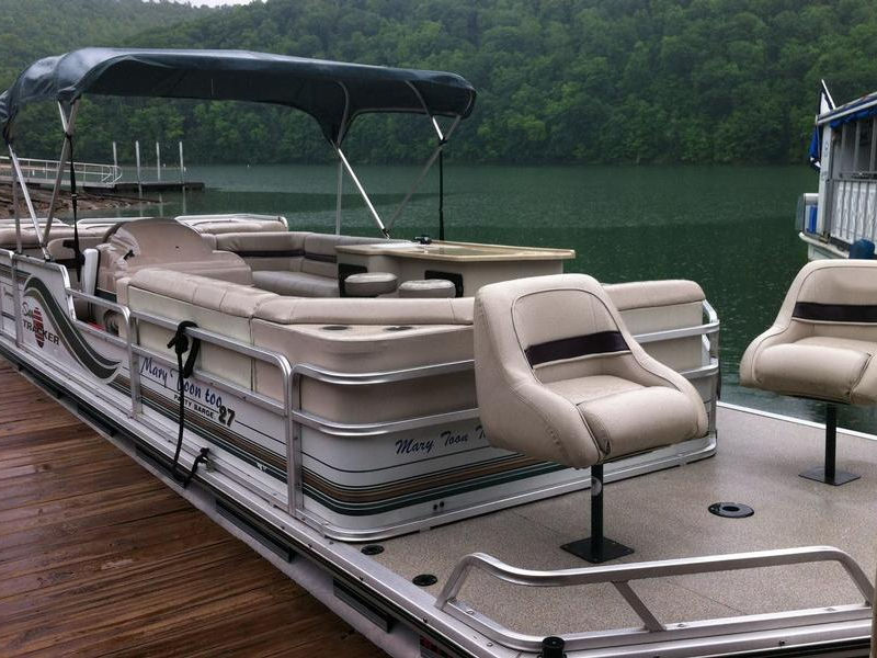 Take out a comfortable patio boat for a picnic out on the water Photos